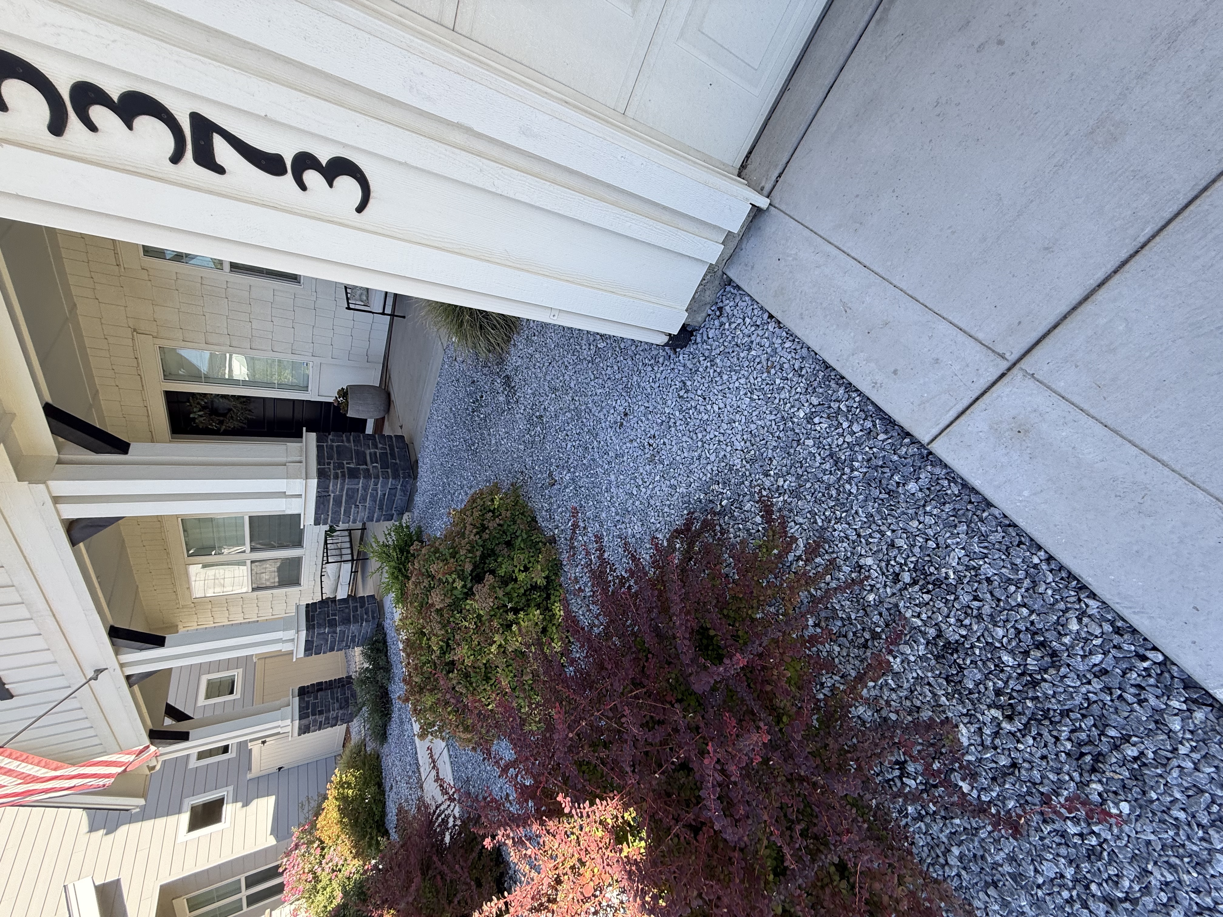 Gravel installed alongside driveway
