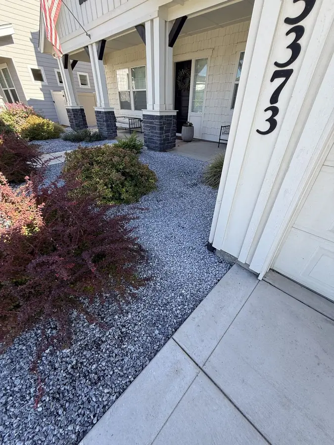 Gravel installed alongside driveway
