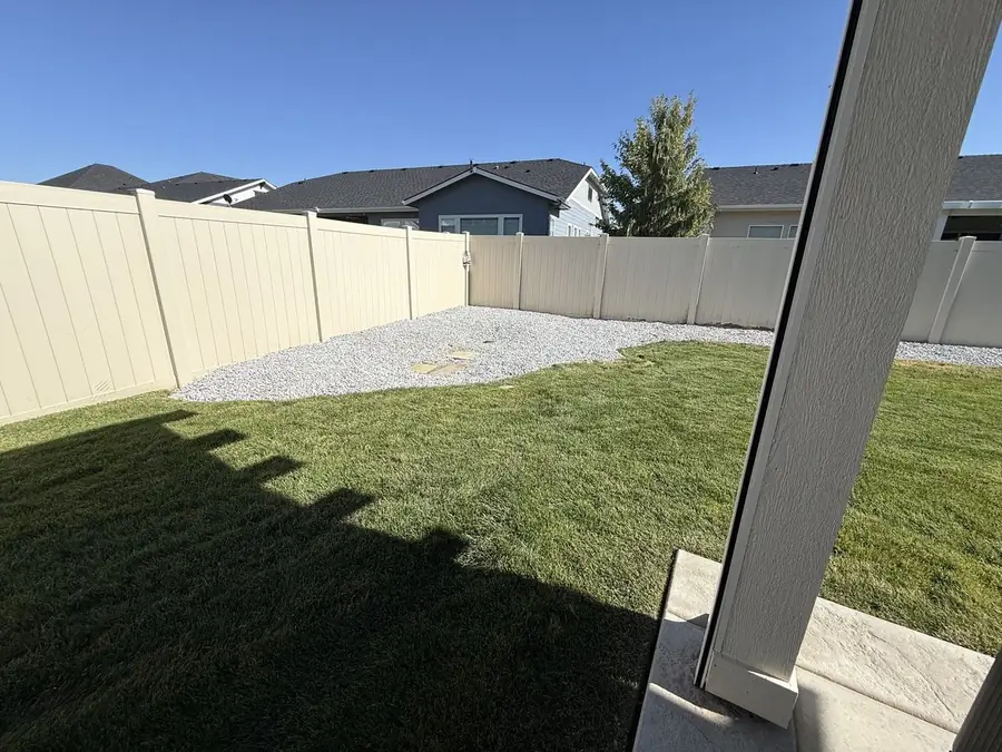 Finished backyard beds with blue gravel - Meridian Idaho