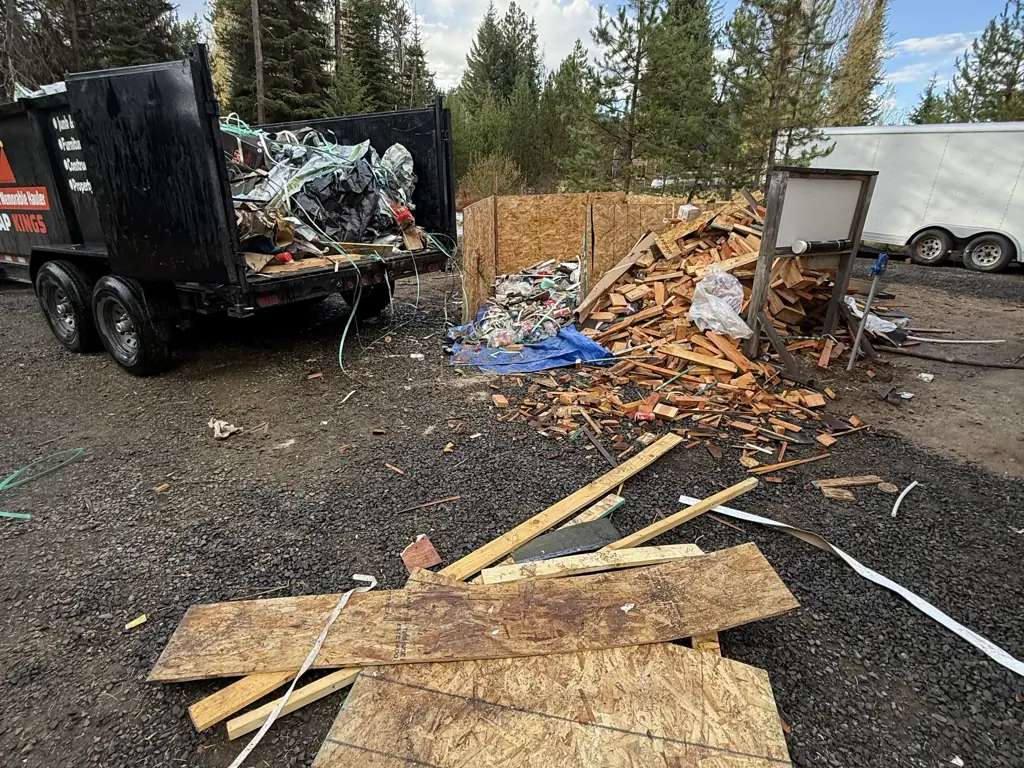 Crap Kings dump trailer hauling construction debris on a jobsite in the McCall, Idaho area