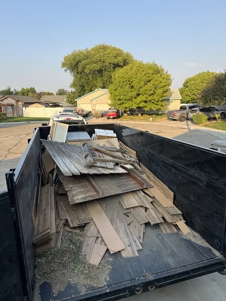 Crap Kings dump trailer loaded with wood and debris on a Nampa, Idaho job